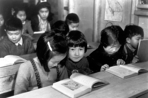 Black and white image of students in classroom