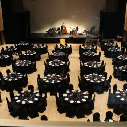 Kobayashi Hall black tablecloth setup with round tables