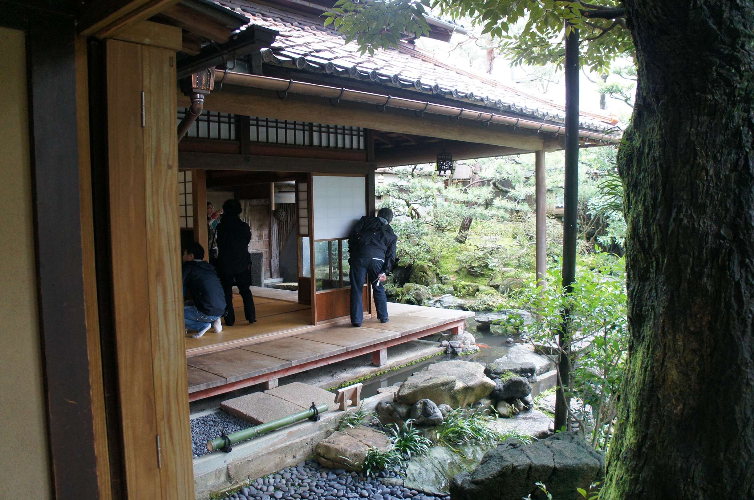 Engawa – a long narrow wood floor laid along the perimeter of a room in a Japanese house and used as a corridor or entrance.  It may be enclosed by sliding shutters or it may be left open.