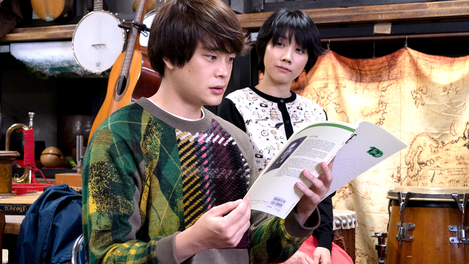 man reading through a book