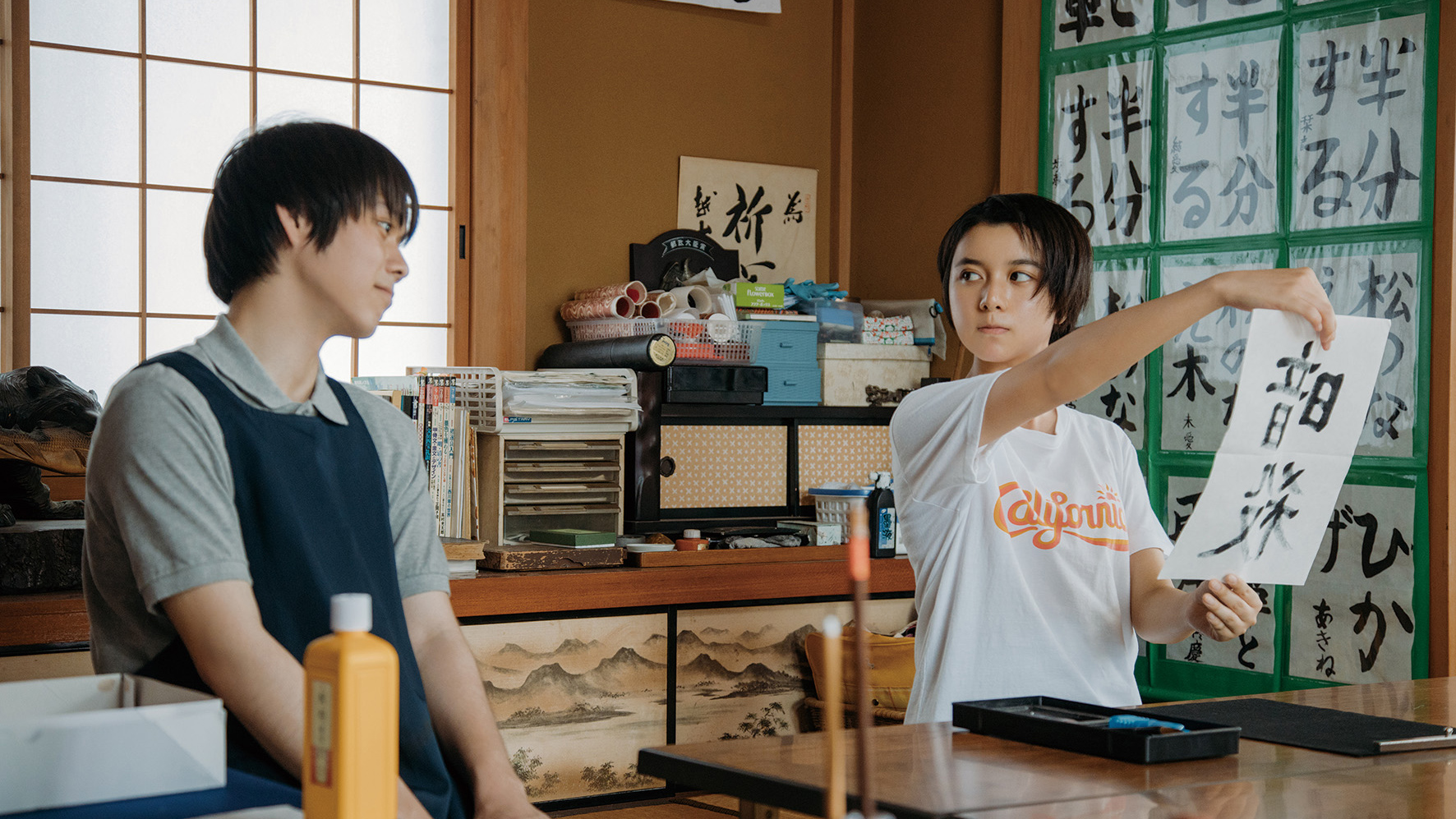 two people looking at caligraphy