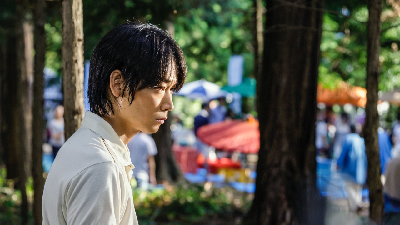 Promised Land a man standing between trees