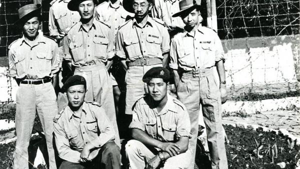 A Group Portrait of Nine Men in Military Uniform; Southeast Asia